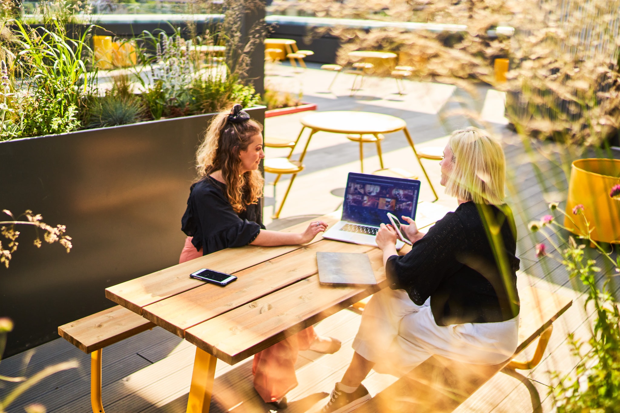 Two women looking at a computer screen