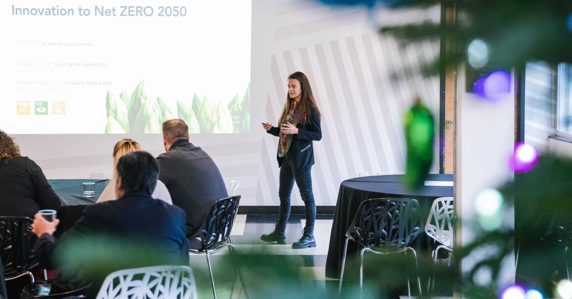 Person presenting at a Plus X Innovation event