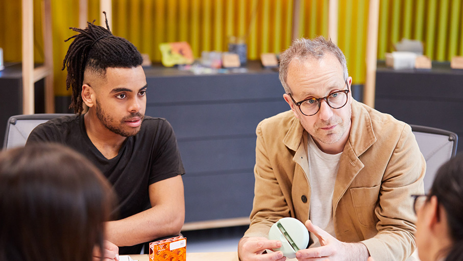 a group of people sitting around a table