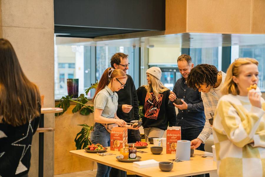 Members enjoying food together at a Plus X Innovation event.