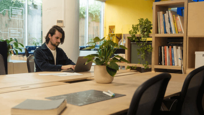 A person working with the tools in the workshop at Plus X Innovation Brighton