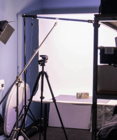 A person taking a taking a photograph in the photography suite at Plus X Innovation Slough