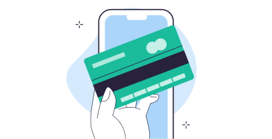 Hand holding a green credit card in front of a smartphone screen.
