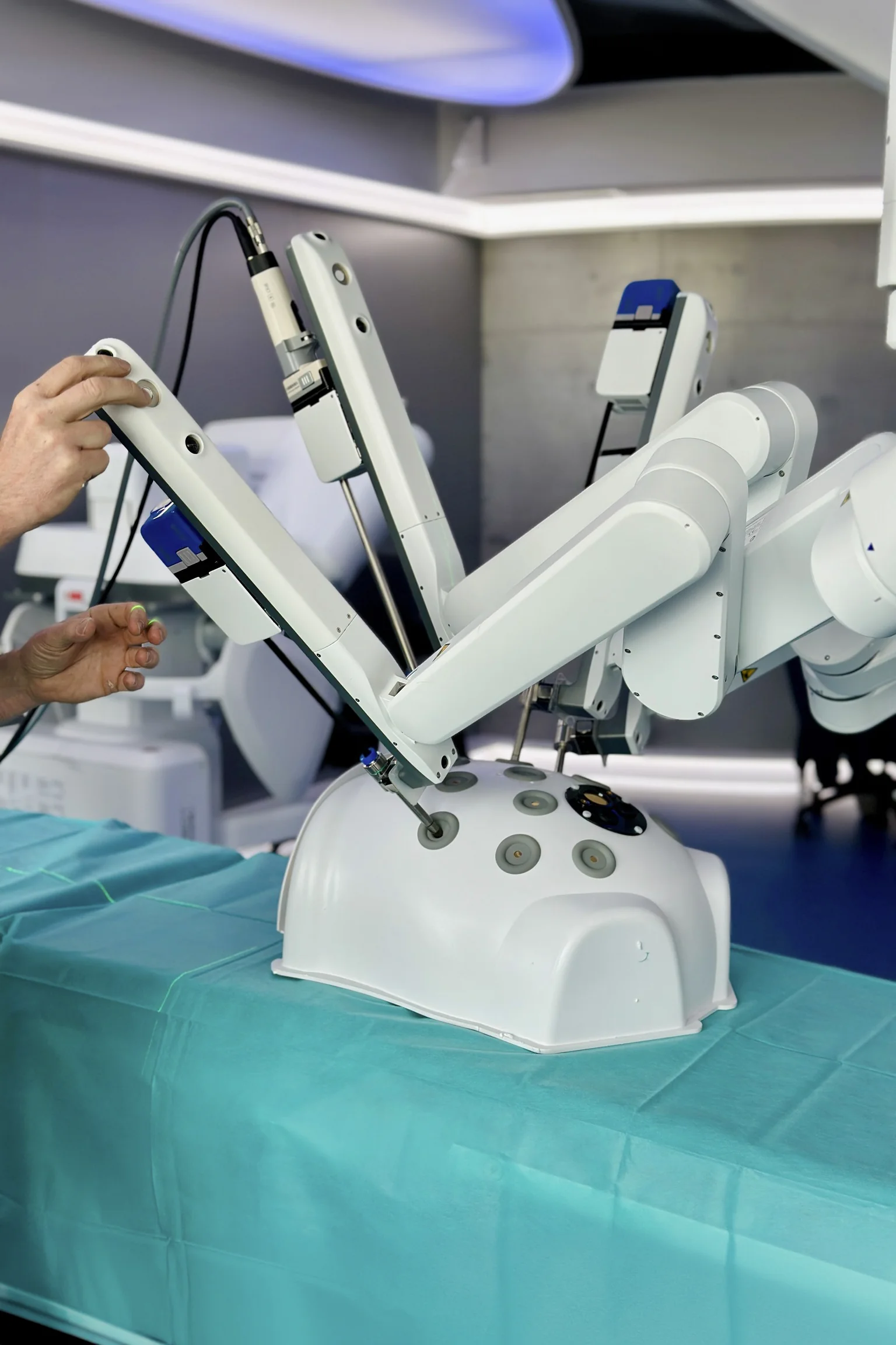 Medical device design by Speck Design showing MicroPort surgical robot arms positioned for minimally invasive procedure workflow