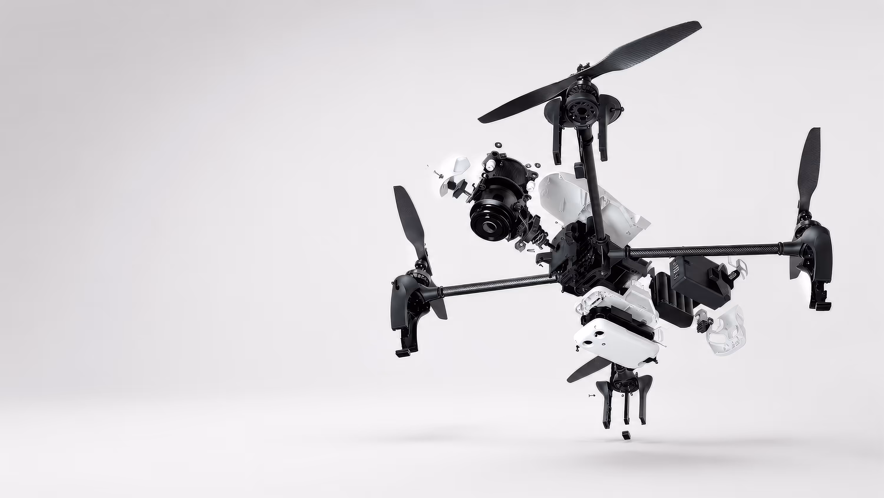Exploded view of a drone showing the internal mechanical and electrical engineering behind a hardware product developed by Speck Design