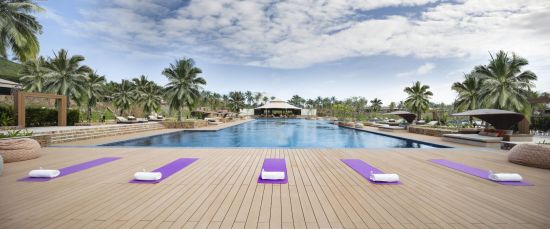 Fusion Resort Cam Ranh in Nha Trang:  yoga at the pool