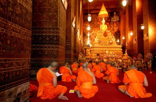 River of Kings in Bangkok: Bangkok: Buddha image and monks in Wat Pho Temple