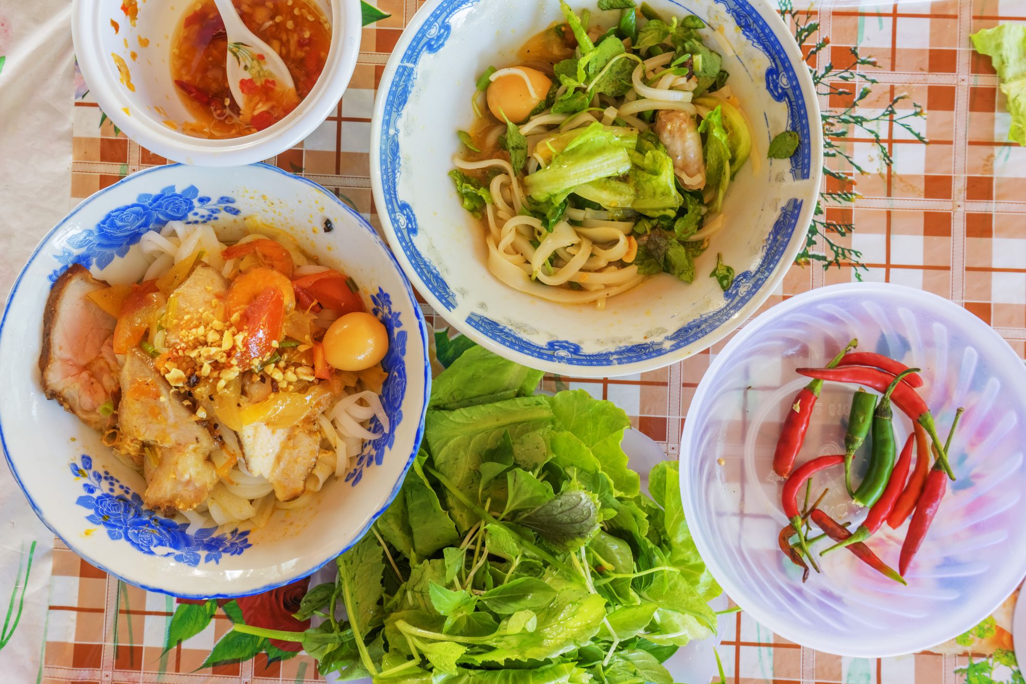 Vespa Street Food Tour in Saigon: Vietnamese noodle Mi Quang