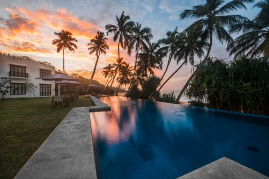 Kumu Beach in Balapitiya:  beach: exterior: Sunset over Pool