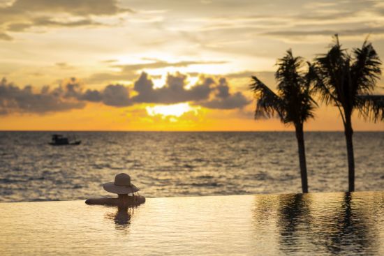 Dusit Princess Moonrise Beach Resort in Phu Quoc:  Pool at sunset