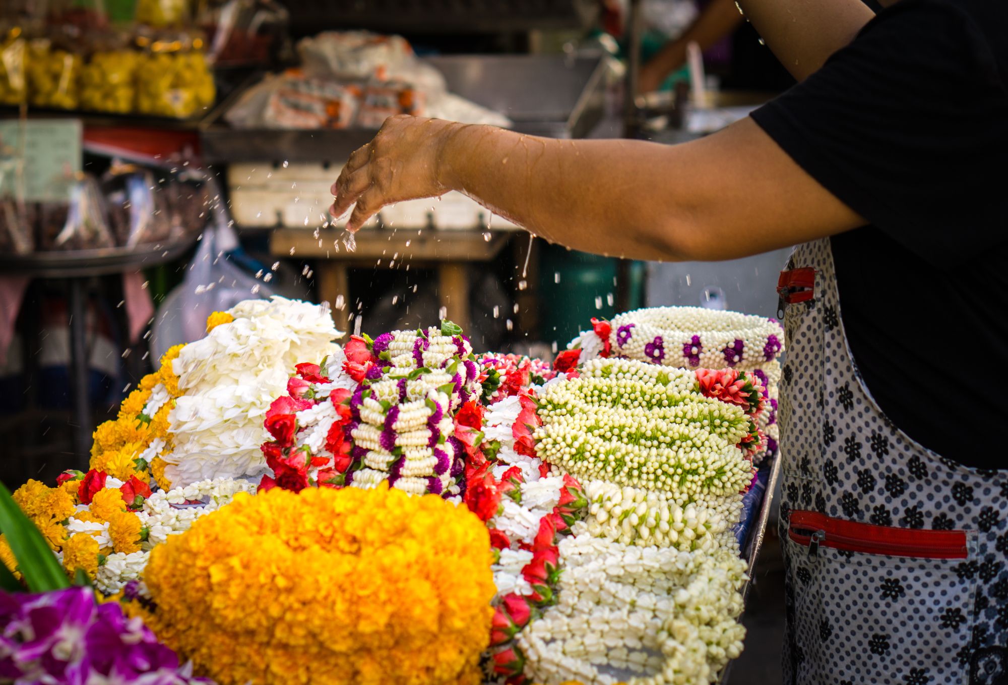 Bangkok Explorer: Watering jasmine garland in Thailand street market