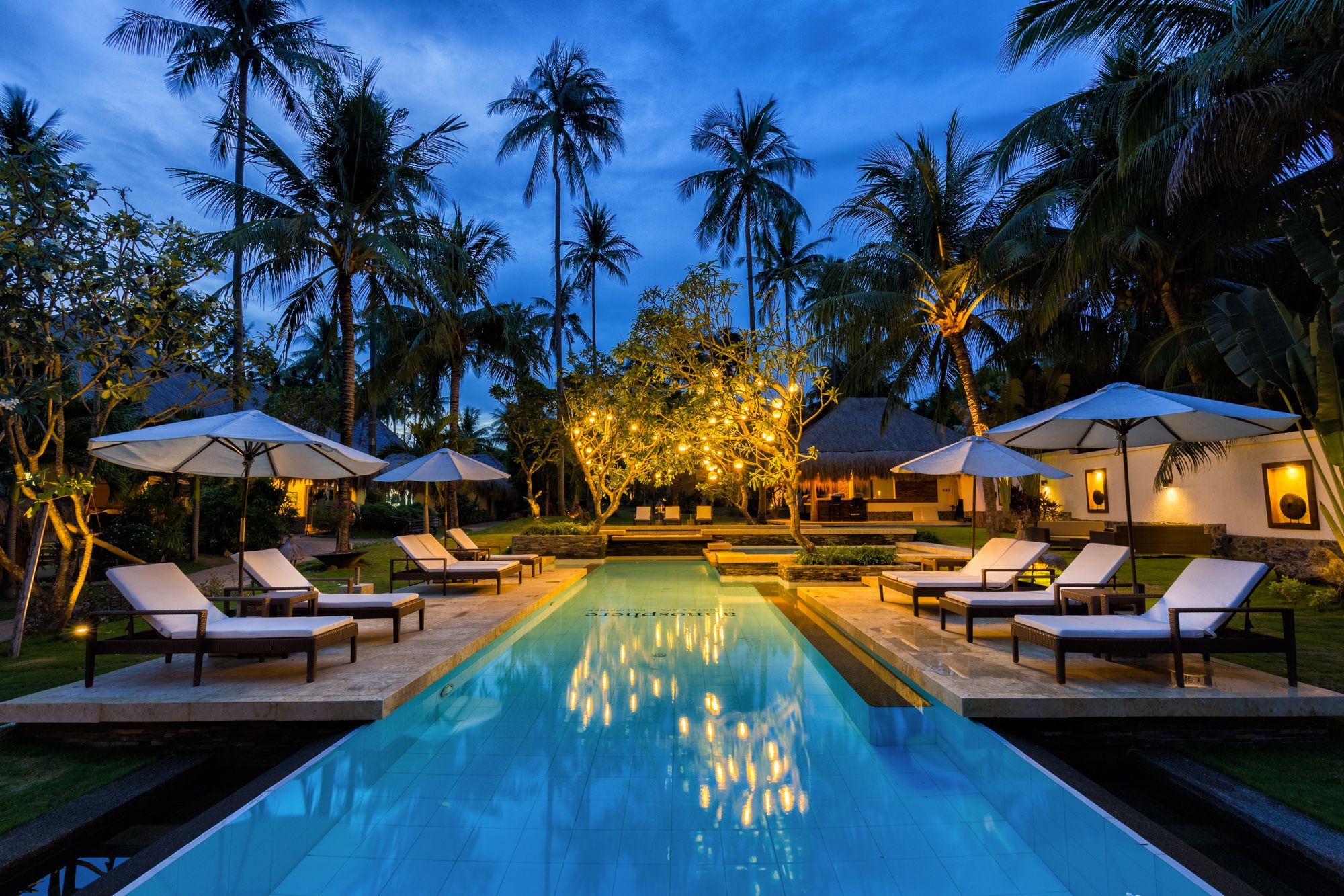 Atmosphere Resort in Negros: Lounge pool in evening lighting