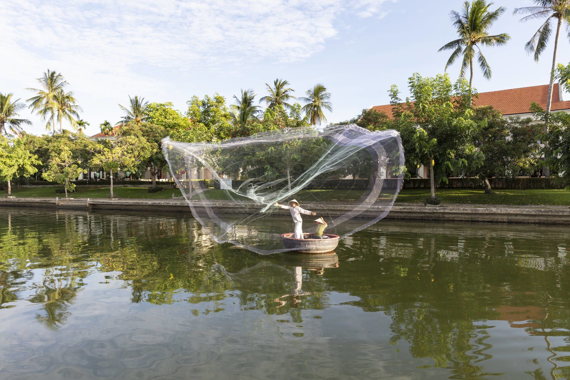 Anantara Hoi An Resort: Fisherman at the Resort Riverfront