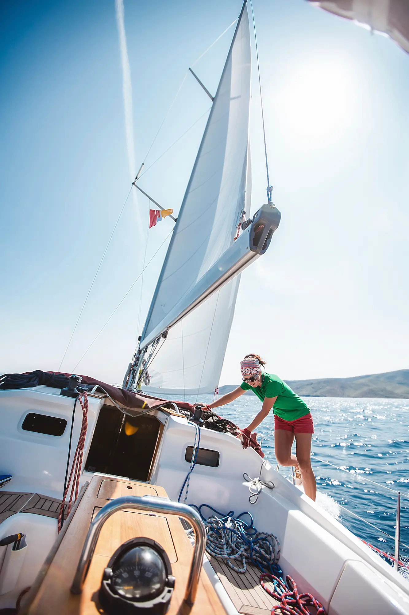 Woman enjoying yacht sailing during crew training course