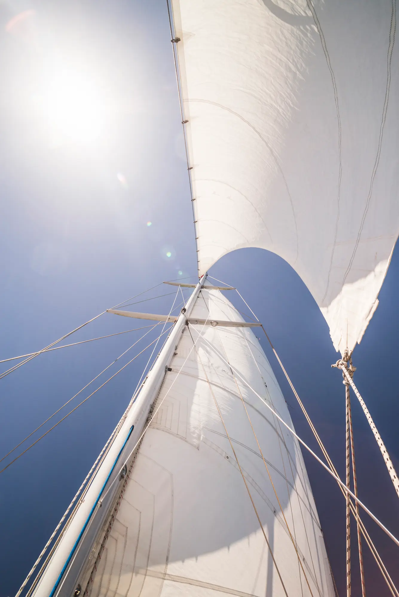 Sailing yacht mast and sails in Mallorca bay
