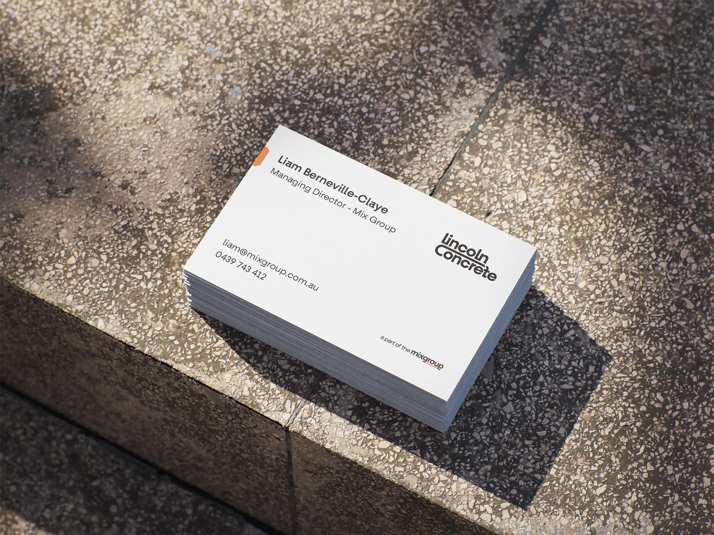 A stack of business cards showing off the design for Lincoln Concrete.