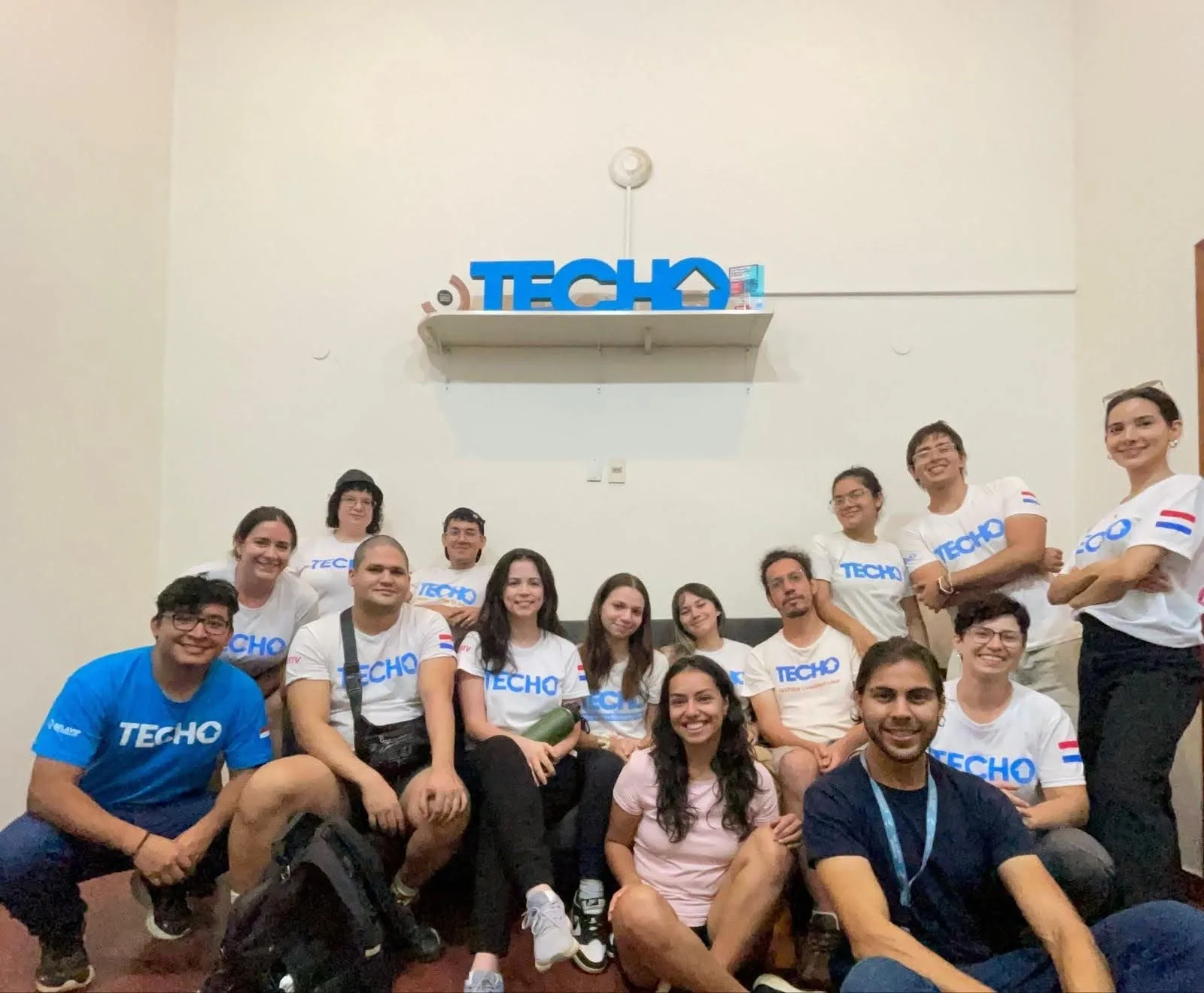 Deriv Asunción employees in the TECHO office.