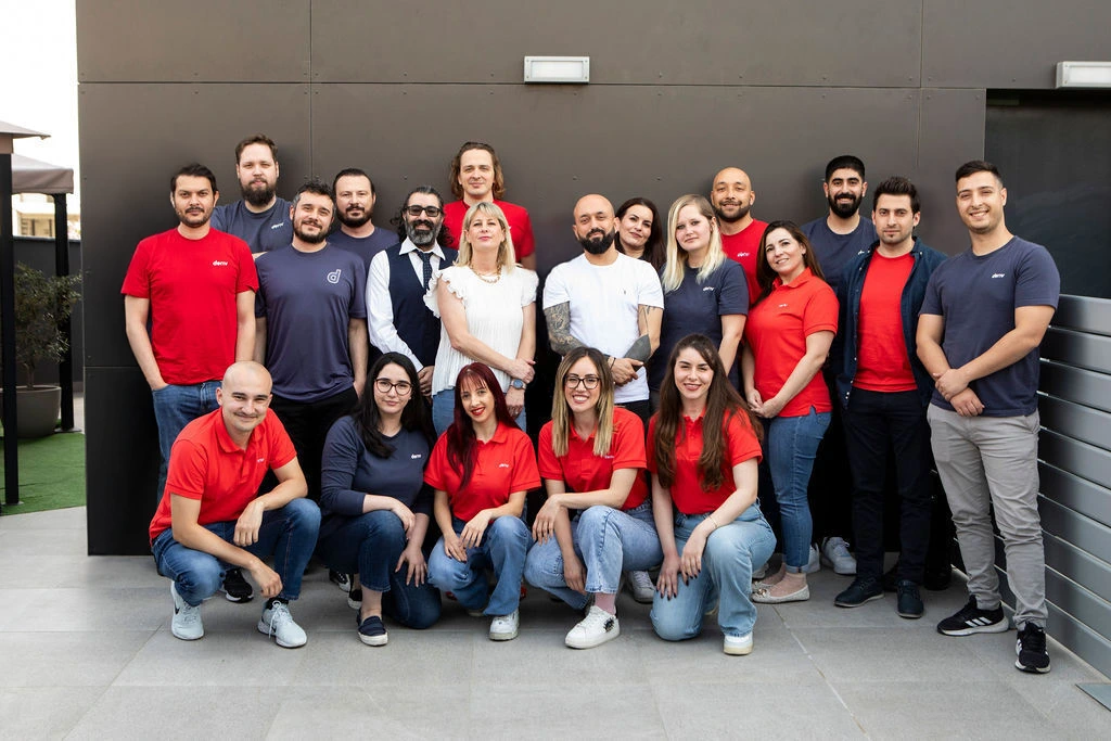 Deriv employees celebrate the company's 5th anniversary alongside its Best Place to Work recognition.