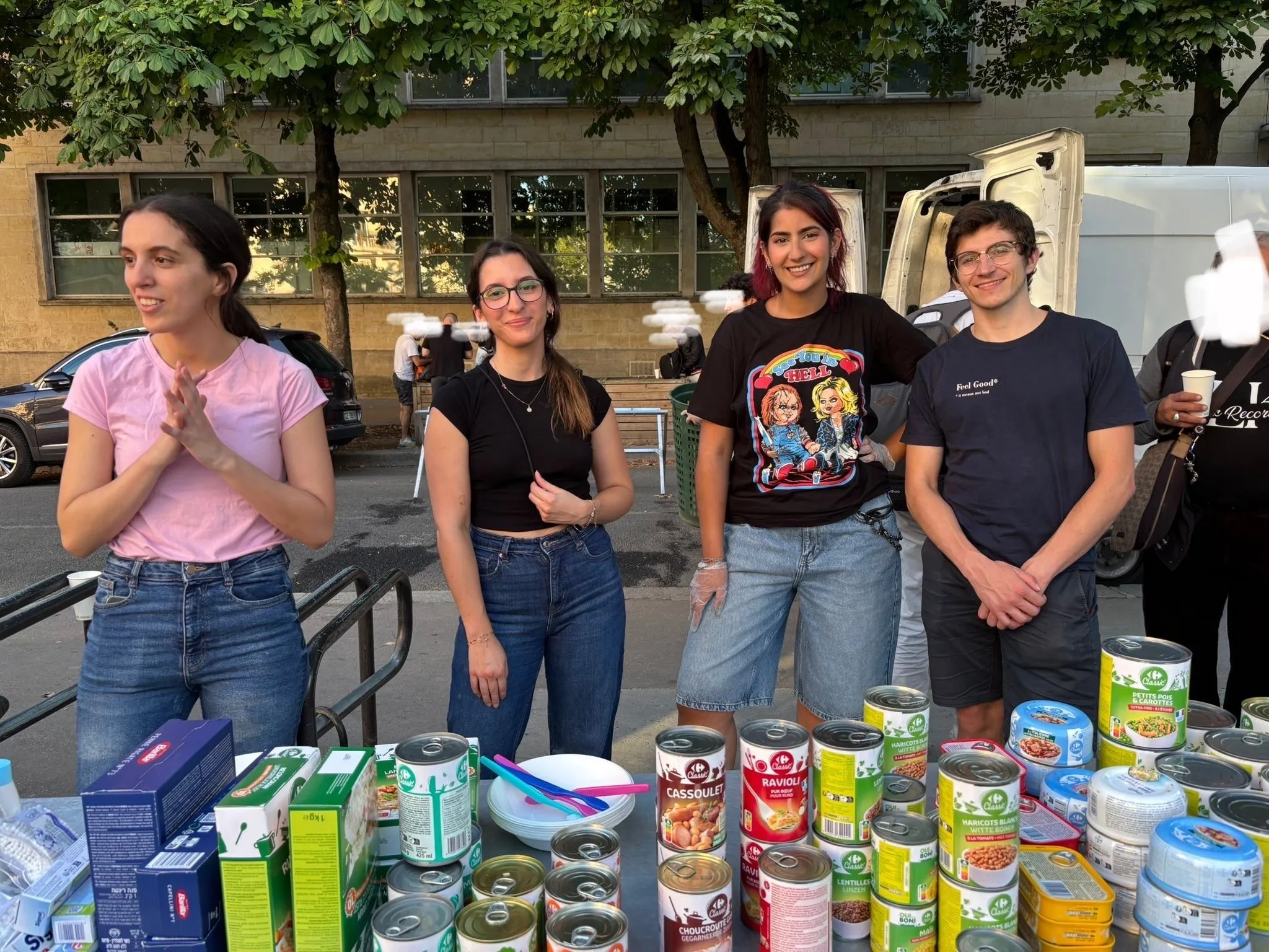 Deriv volunteers distributing food and hygiene products in France with Restos du Coeur