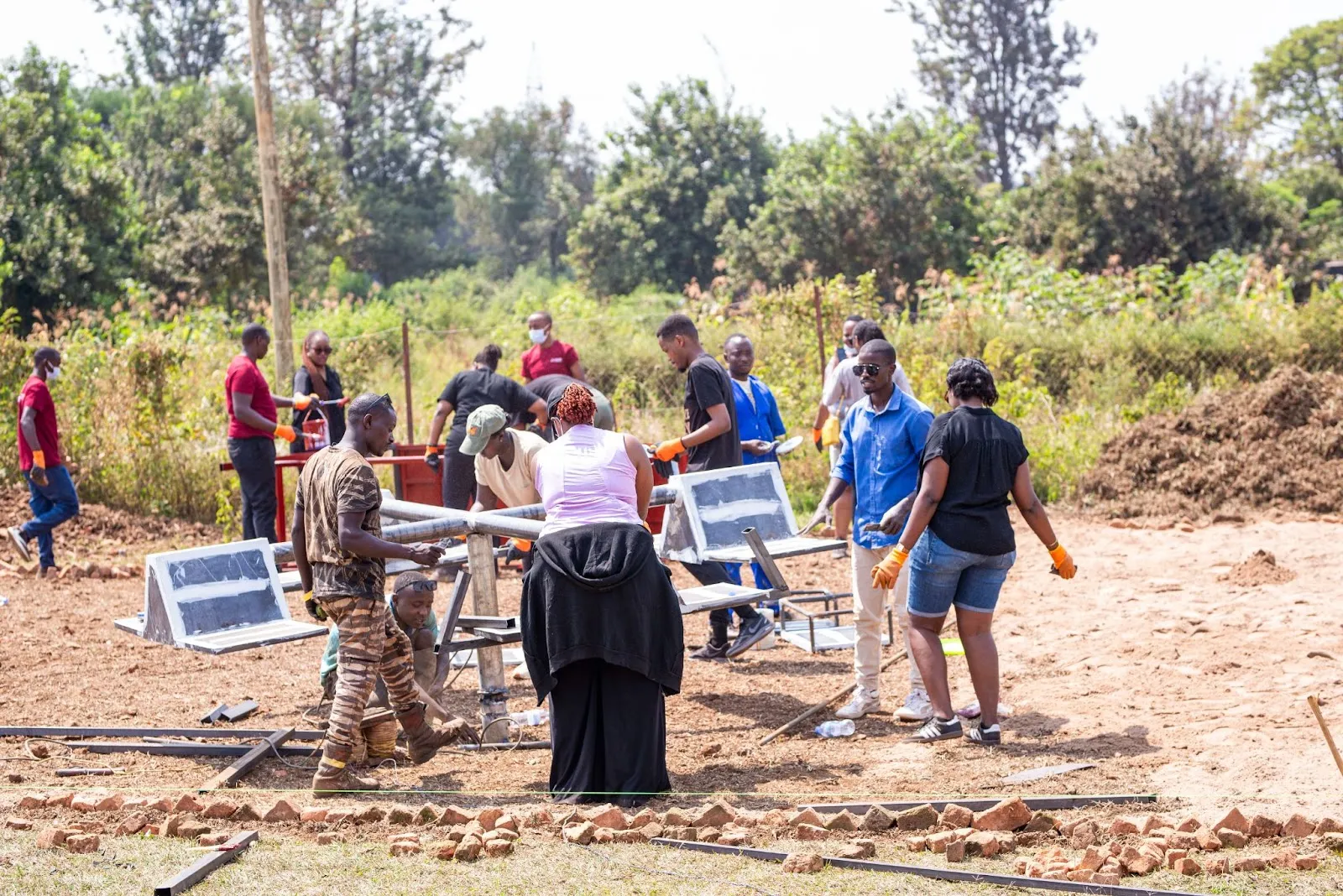  Volunteers planting grass at Tubiteho School to build a safe and inclusive football pitch for children with disabilities.‍