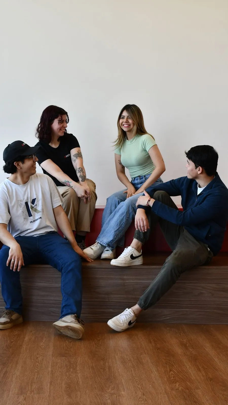 Deriv staff enjoying a light moment, reflecting a positive and open workplace environment