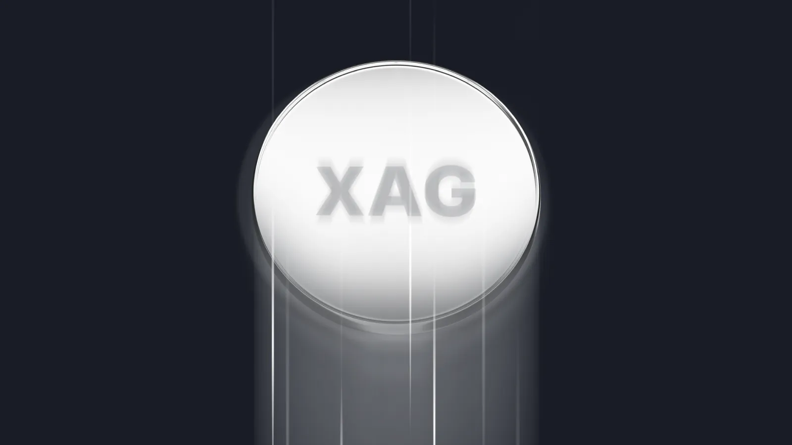 A glowing silver coin with the text "XAG" in bold letters at the centre, appearing to move downward with motion blur on a dark background.