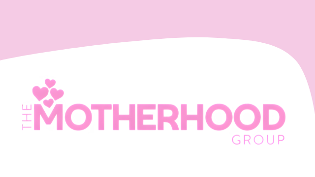 The logo of The Motherhood Group, set in front of a light pink background.