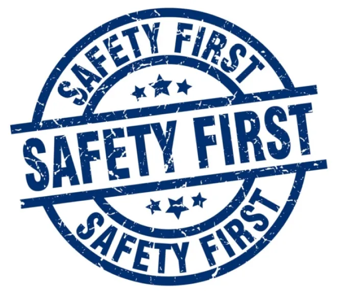 A blue stamp with the words safety first on it.