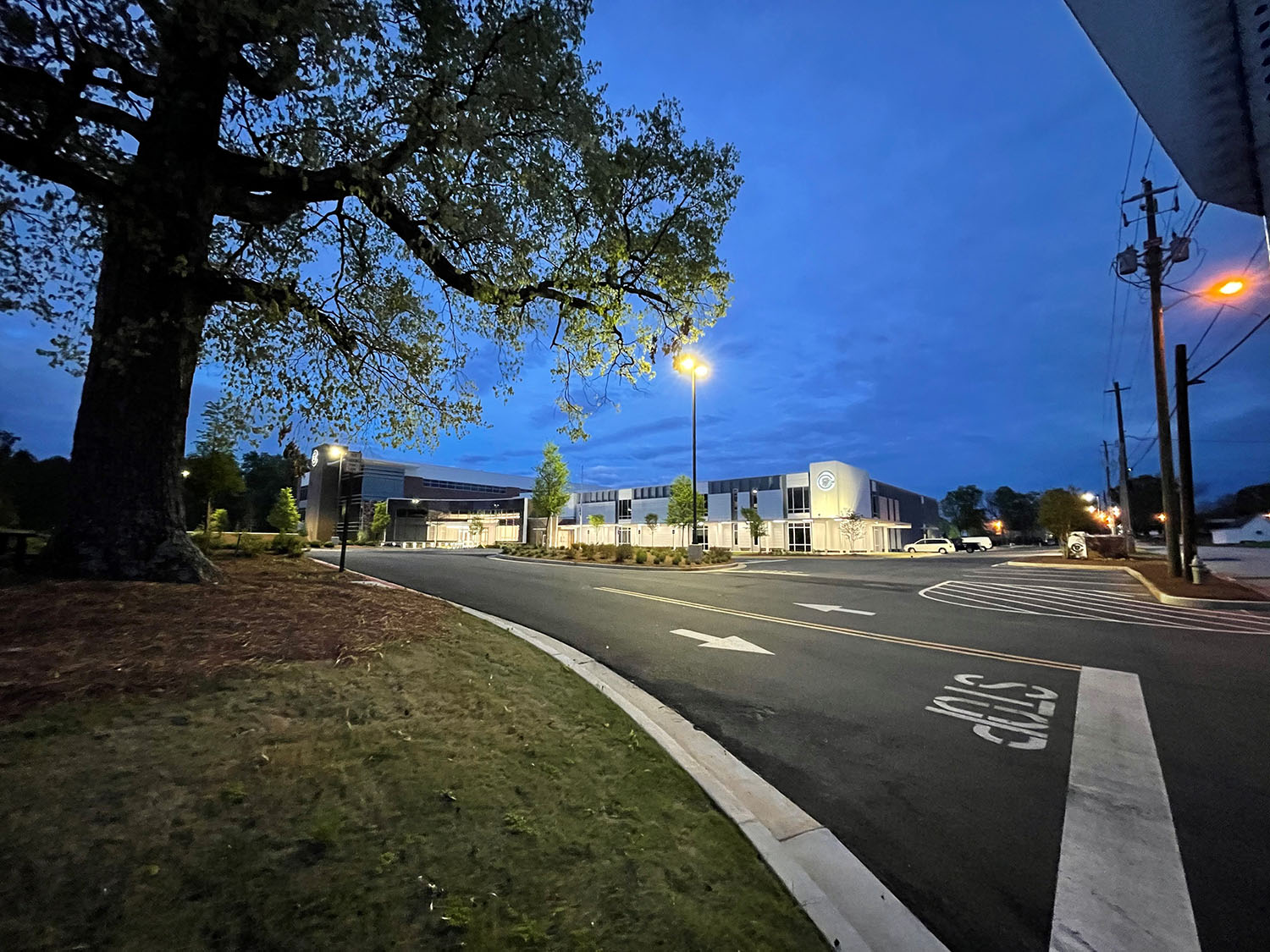 A group of silver cups sitting on top of a table.