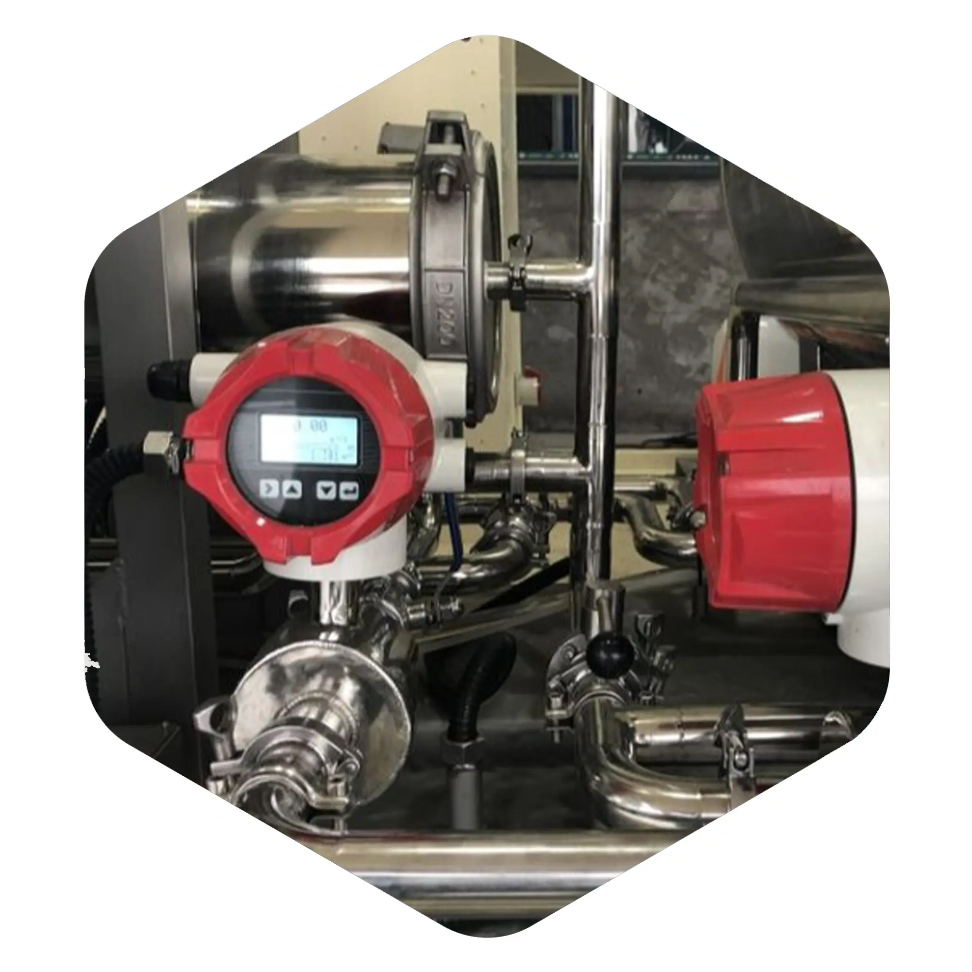 Supmea A100 electromagnetic flow meter integrated into a complex stainless steel piping network, providing high accuracy fluid measurement for industrial applications.
