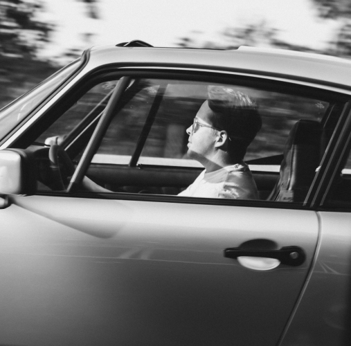 Man driving sports car