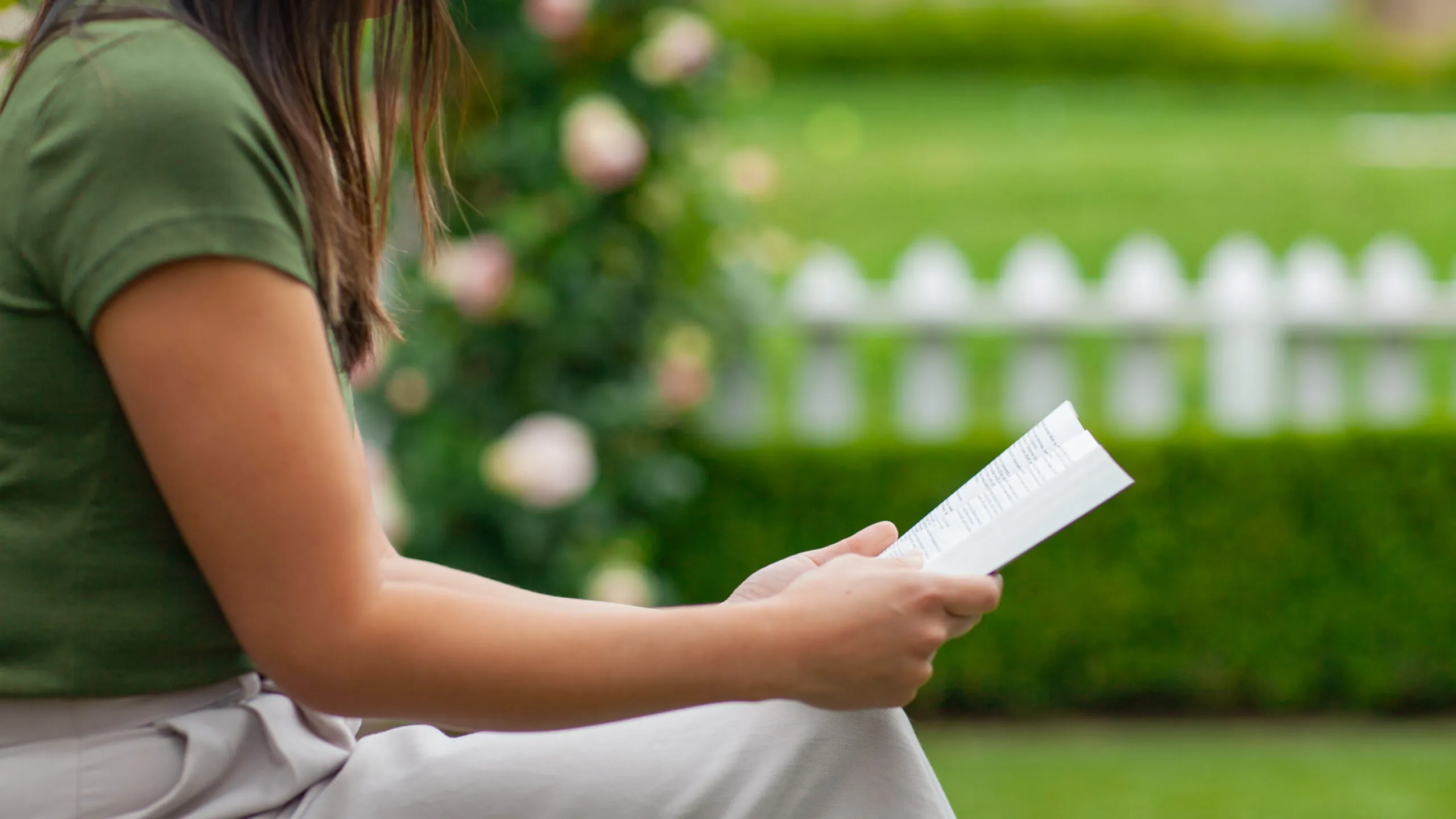 woman reading the Bible outdoors