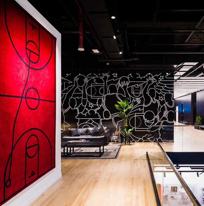 Jordan retail store fixture featuring custom red metal frame structure and display design during installation