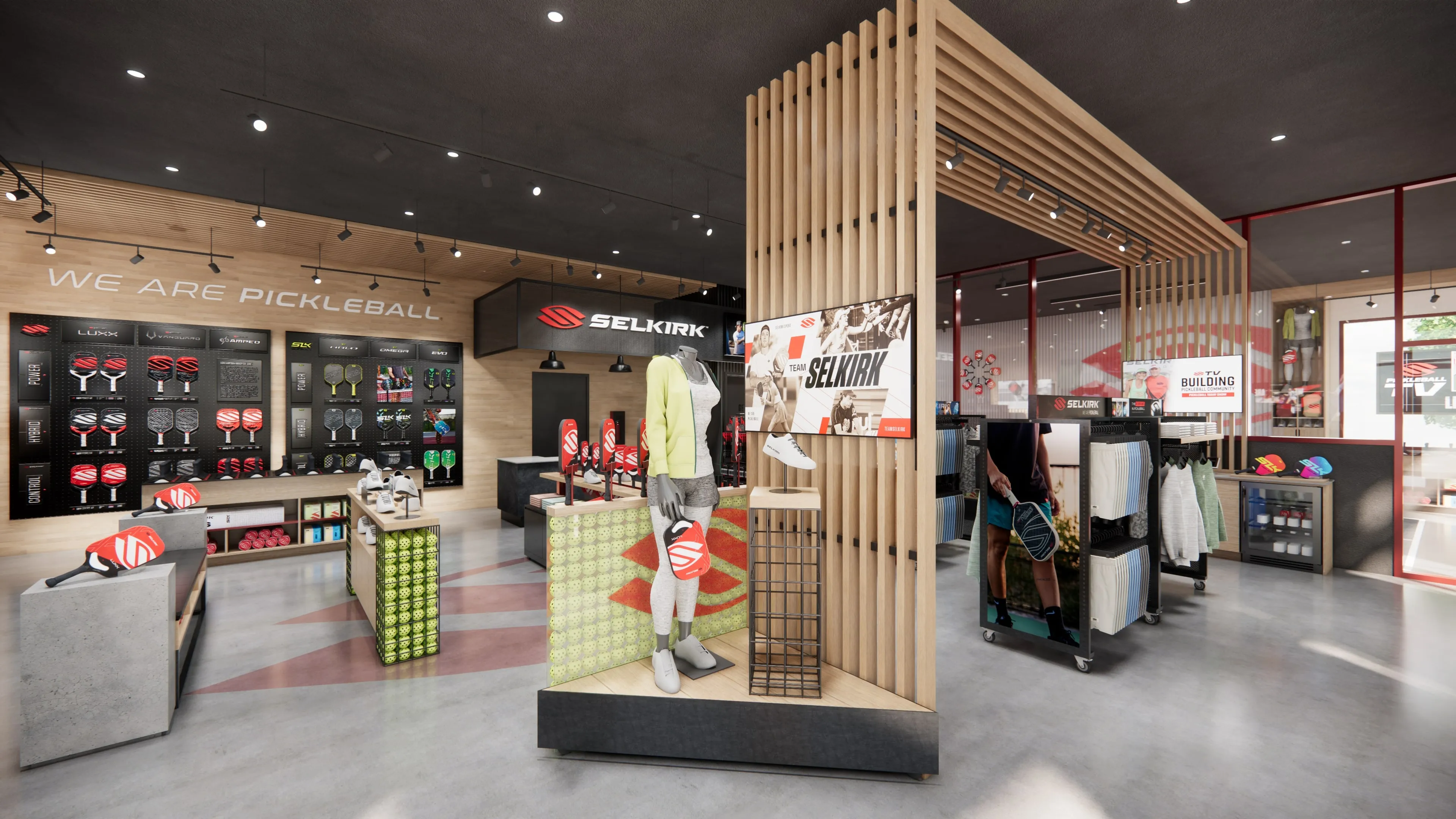 Selkirk pickleball retail store interior with wood slat display fixture, apparel merchandising wall, product displays, and 'We Are Pickleball' branded signage