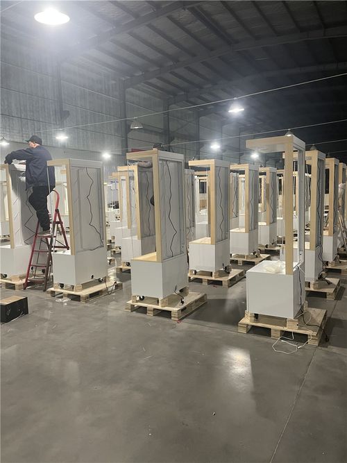 Smith Displays retail fixture manufacturing facility with multiple wooden display boxes and structures in various stages of assembly lined up on warehouse floor