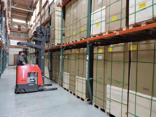 Manufacturing warehouse with industrial pallet racking, metal storage system, and custom fixture packaging