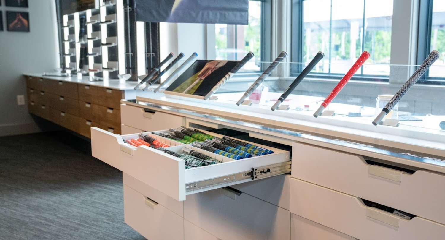 Golf Pride Retail Lab educational display showcasing grip technology, product comparison, and customer engagement through interactive merchandising