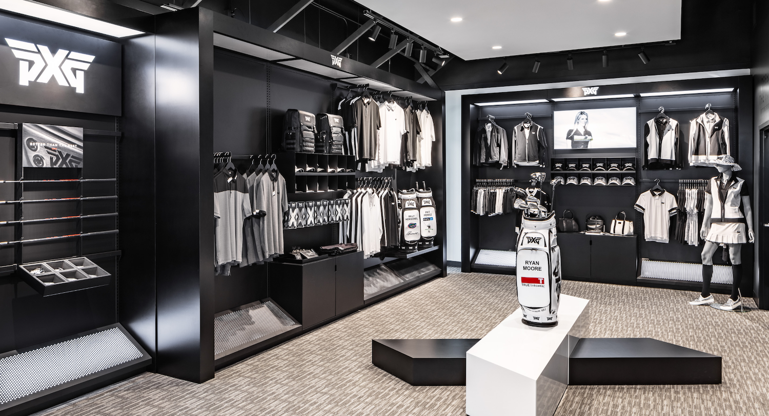 PXG Performance Studio entrance with branded apparel displays, premium merchandising, and customer navigation-focused layout
