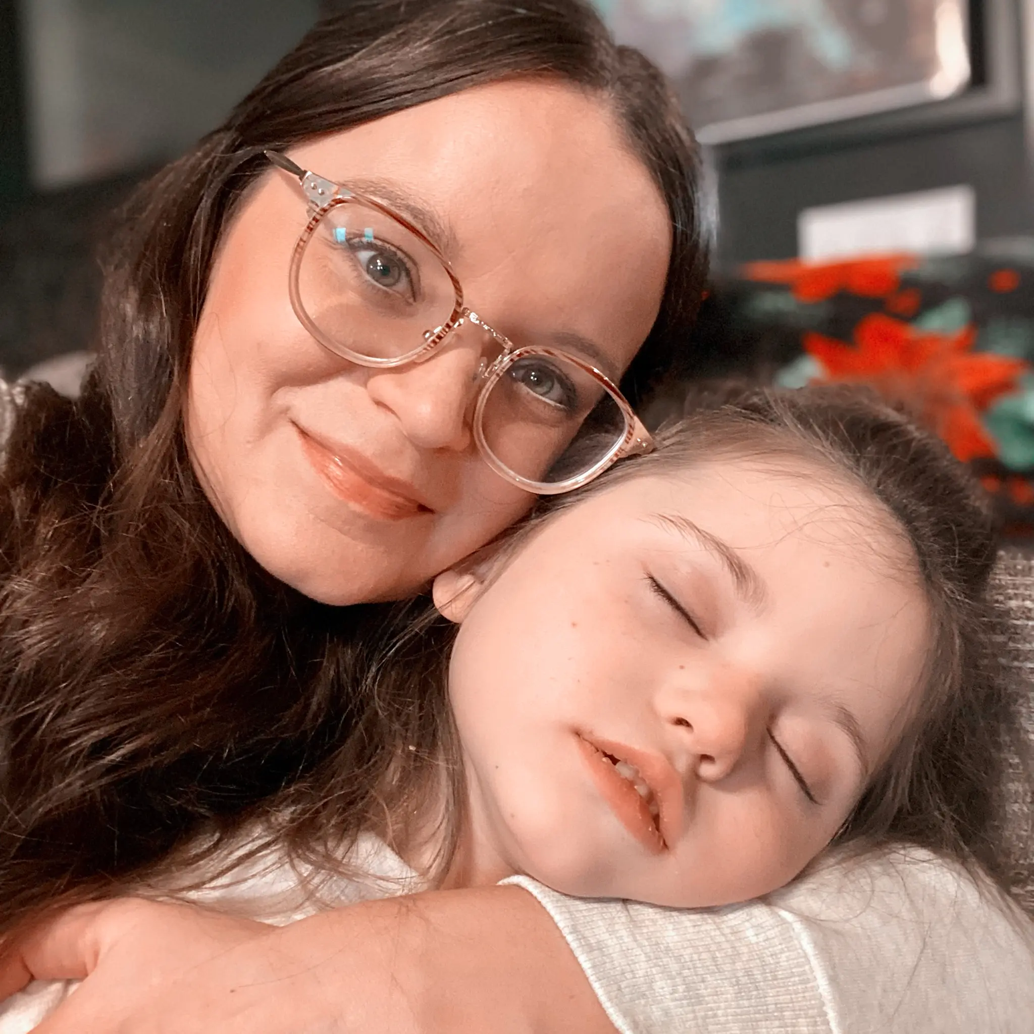 A mother hugging her daughter