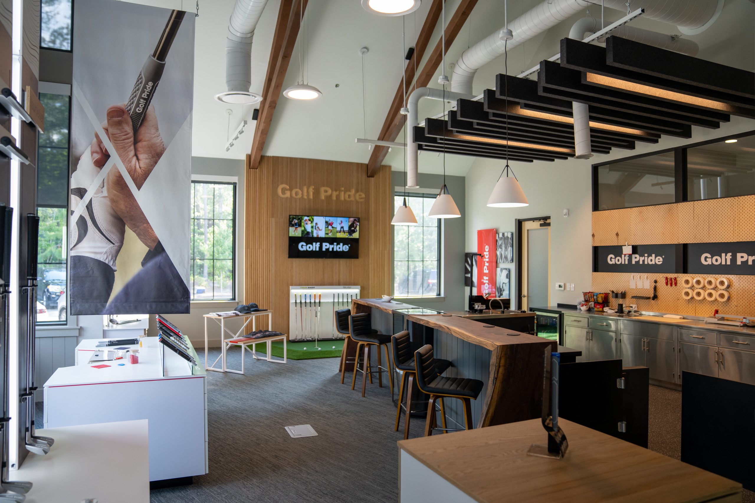 The Golf Pride Retail Lab, with fitting bays and club walls.