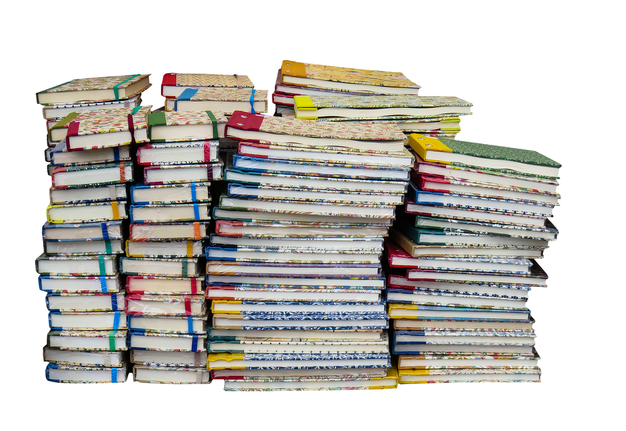 Stack of traditional piano sight reading books on a piano.