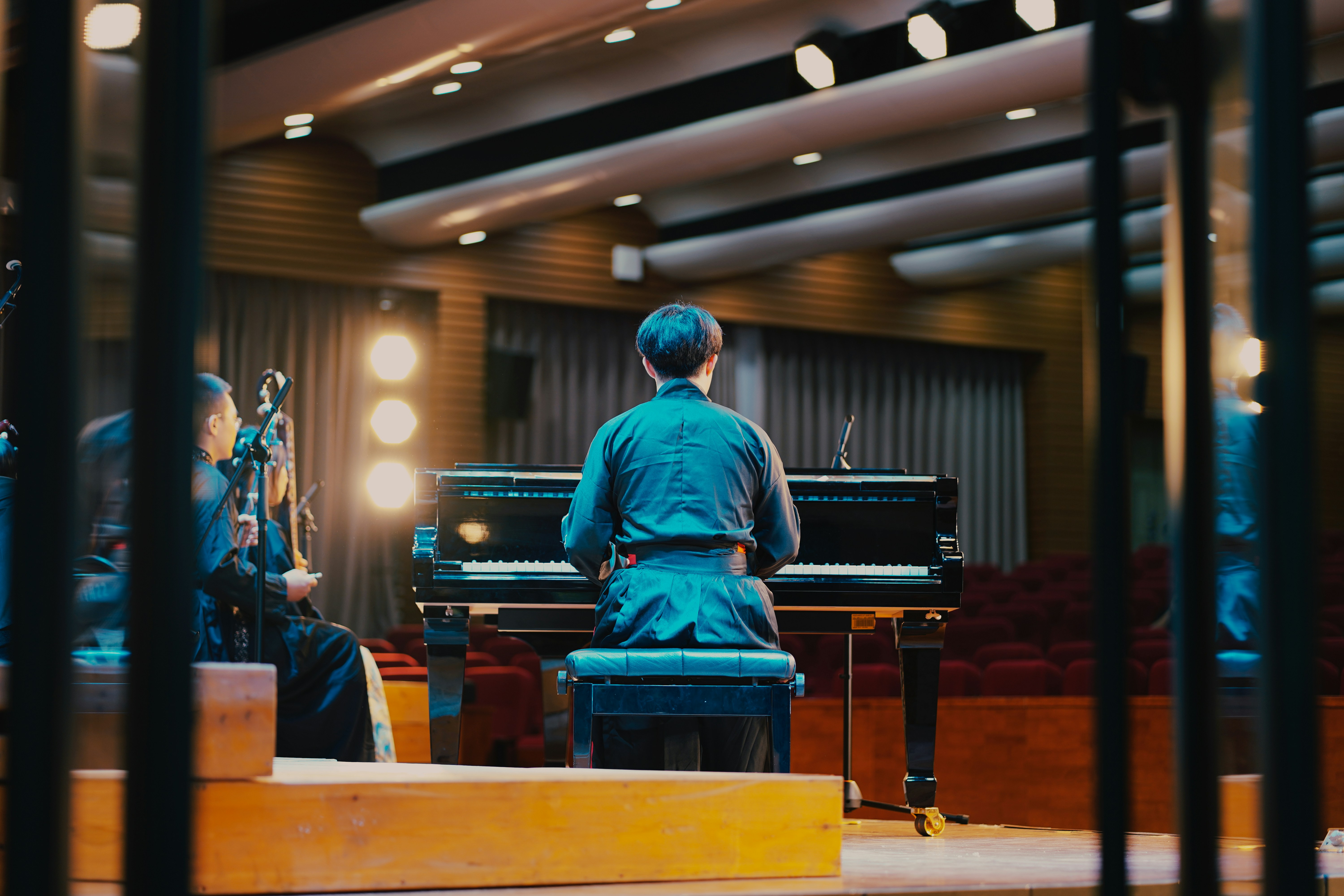 A person sitting at a piano MuseFlow and sight reading.