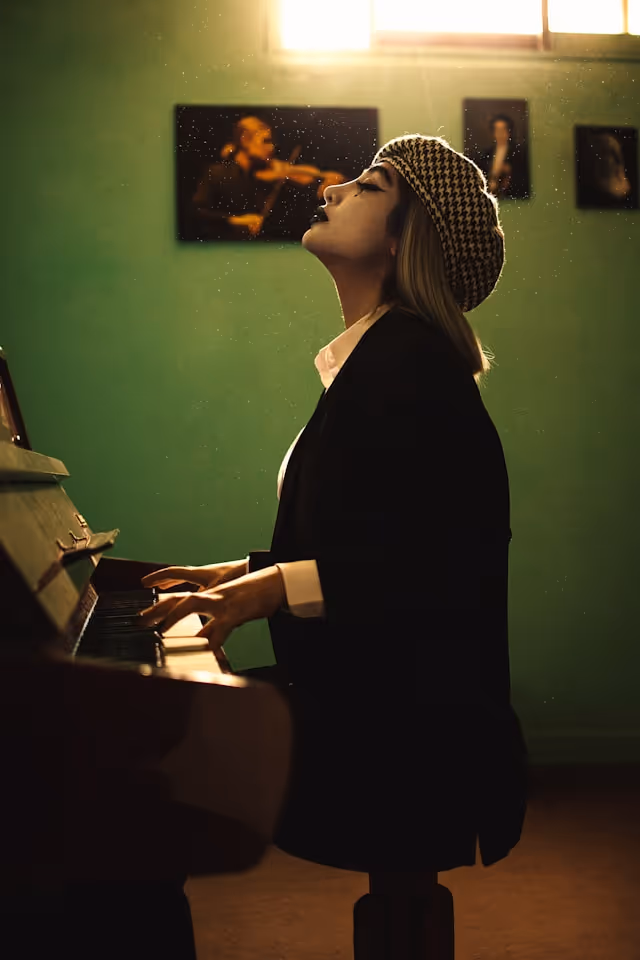 A woman relishing in the joys of playing piano.