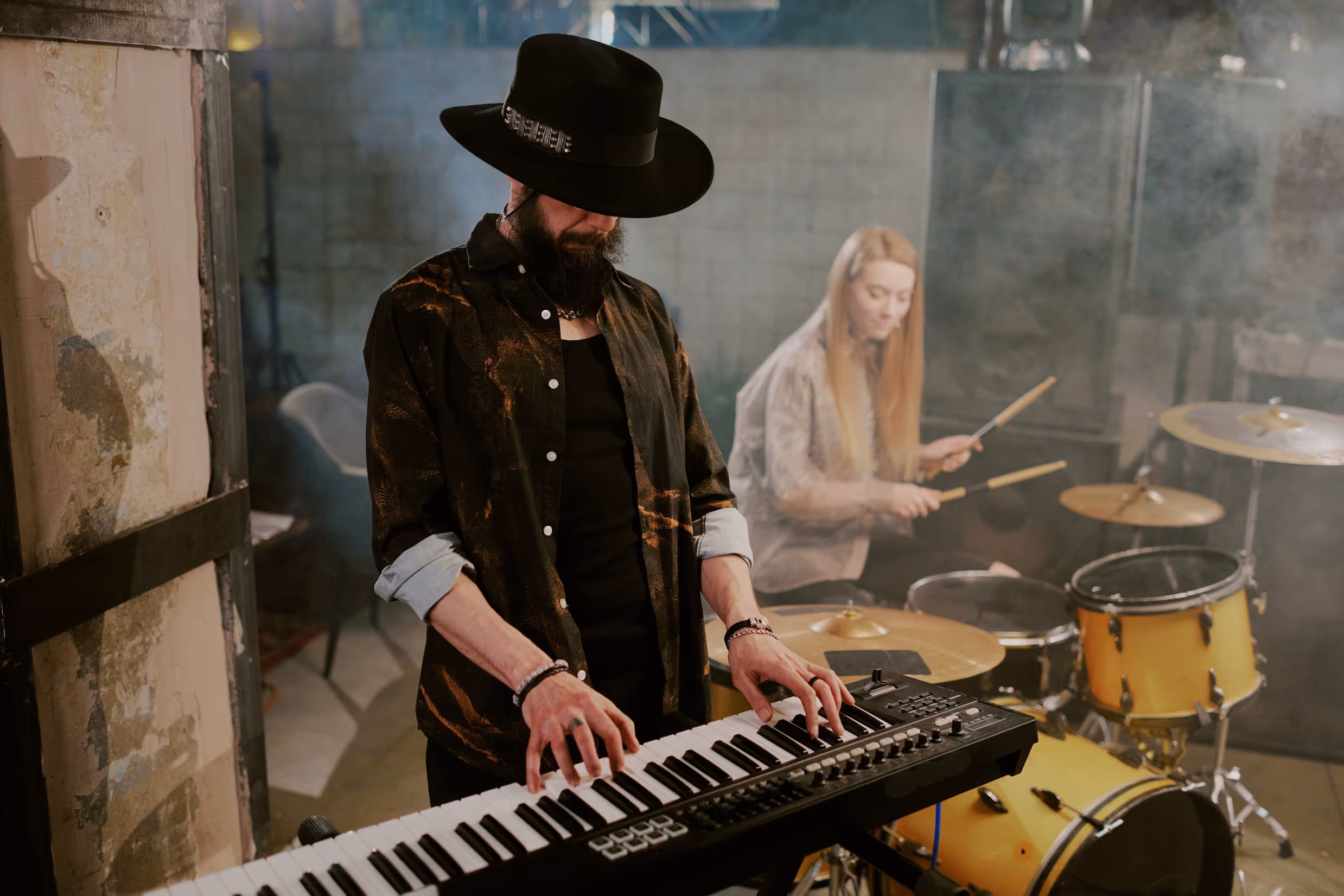 A man and woman overcome piano learning myths for adults.