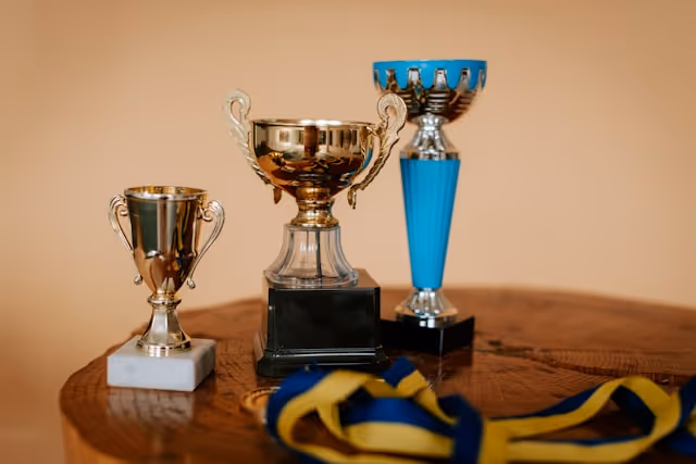 Traditional piano exam certificate and trophy representing structured learning milestones.