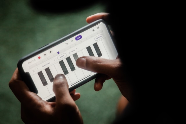 Person using a digital piano lesson with progress tracking.