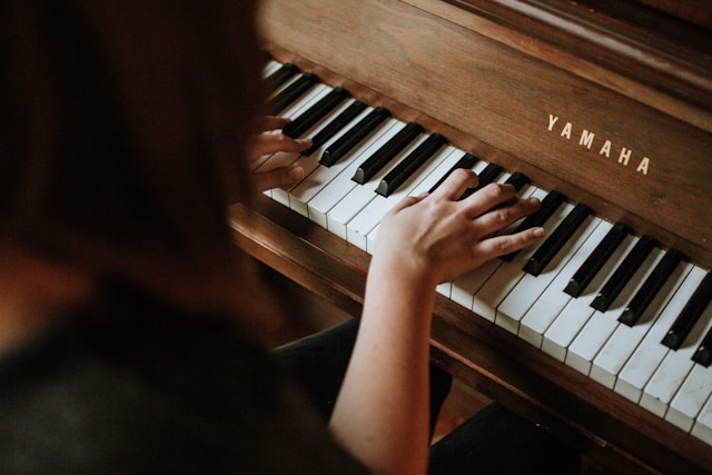 Pianist deeply focused while practicing piano