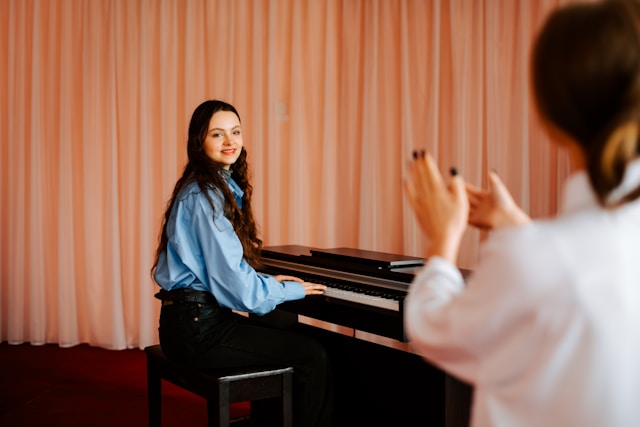 Piano learner celebrating progress after completing a practice session.