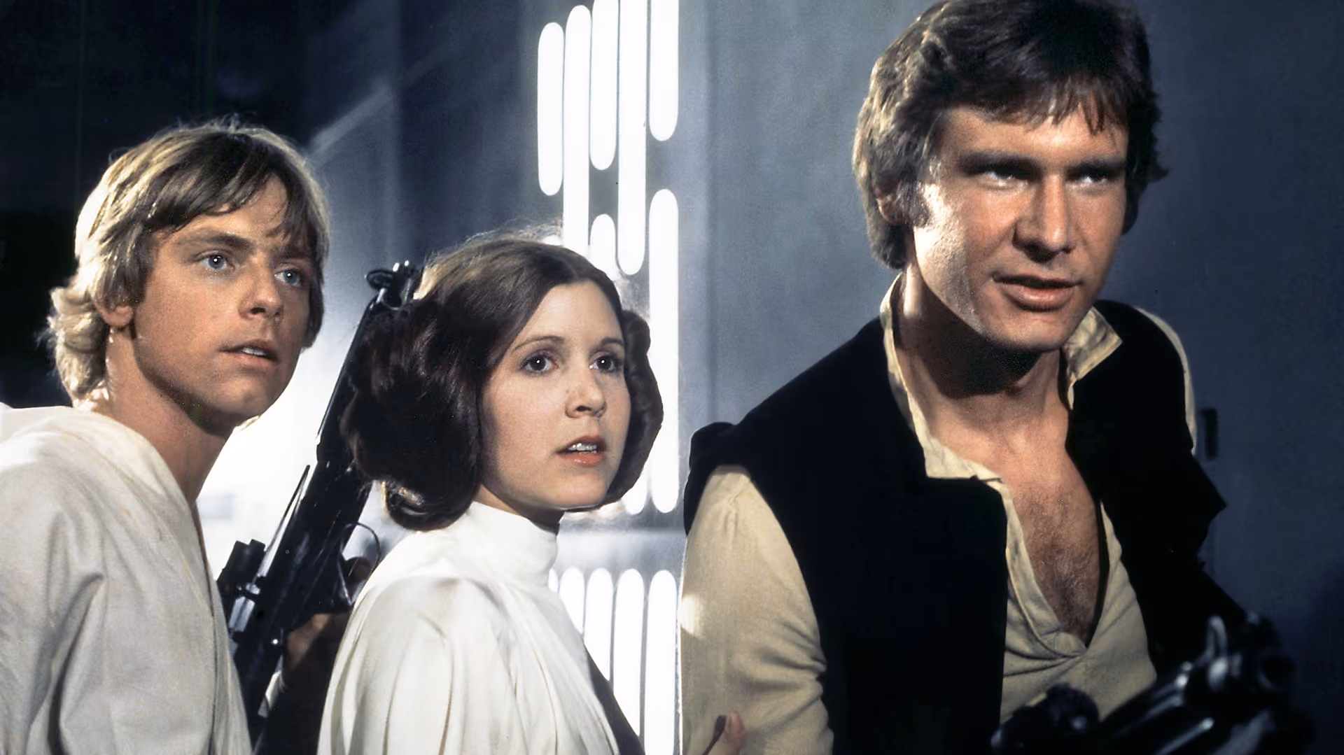 The three leads in Star Wars in their classic pose, all looking out, needing to save the day.
