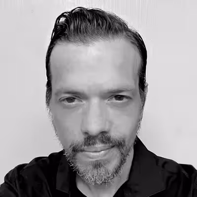 A black and white photograph of John Hansen attempting to smile professionally. 😶